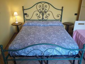 A bed or beds in a room at Amber Apartment