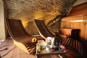 a room with two chairs and a table in a room at MIRUTT Relax by Keyhole Selection in Castelmezzano