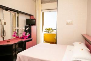 Postel nebo postele na pokoji v ubytování Hotel Ida