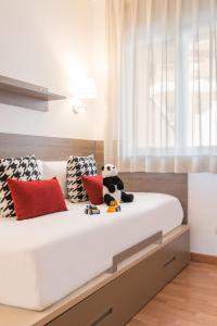 מיטה או מיטות בחדר ב-Pierre & Vacances Andorra Alba