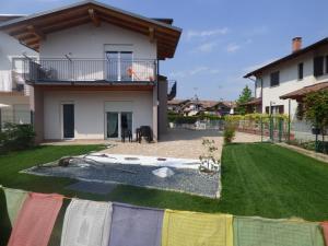 a house with a flag in the yard at Giravento in Borgo San Dalmazzo
