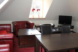 TV a/nebo společenská místnost v ubytování Hotel Haus Kranich