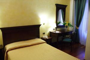 Кровать или кровати в номере Hotel Teocrito