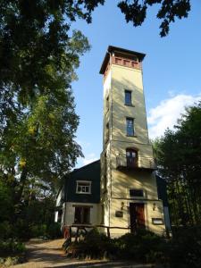 an old house with a tower on top of it at Prinz-Friedrich-August Baude in Sohland