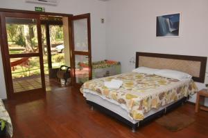 Cama ou camas em um quarto em IguassuEcoHostel - Eco Suítes - Hostel mais próximo das Cataratas