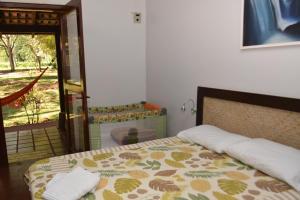 Cama ou camas em um quarto em IguassuEcoHostel - Eco Suítes - Hostel mais próximo das Cataratas