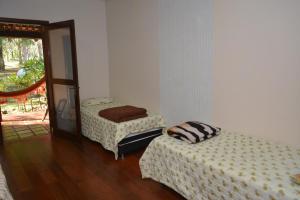 Cama ou camas em um quarto em IguassuEcoHostel - Eco Suítes - Hostel mais próximo das Cataratas