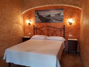 Postel nebo postele na pokoji v ubytování B&B Da Sabrina