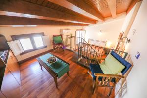an overhead view of a living room with a table and chairs at Madonie Holidays in Cefalù
