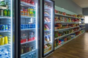 an open refrigerator filled with lots of drinks at Camping Santa Tecla in A Guarda