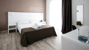 Posteľ alebo postele v izbe v ubytovaní Amada Hotel Siracusa