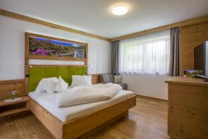 Postel nebo postele na pokoji v ubytování Bergsonne