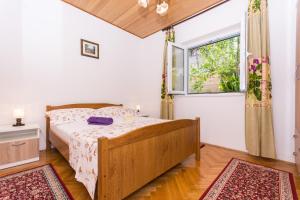 Postel nebo postele na pokoji v ubytování Apartman Maja