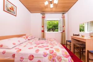 Postel nebo postele na pokoji v ubytování Apartman Maja
