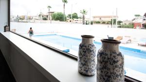 Bazén v ubytovaní Amada Hotel Siracusa alebo v jeho blízkosti