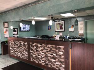 a bar in a restaurant with a counter top at Lone Star Inn in Lubbock