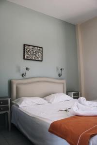 Postel nebo postele na pokoji v ubytování Esperida rooms & studios