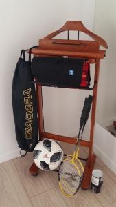 a table with a tennis ball and a racket at Apartment DOLEA in Split