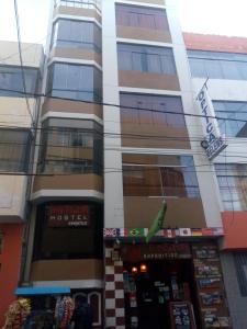 a building with a music studio in front of it at Pacha Hostel in Puno