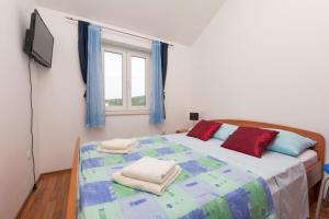 Postel nebo postele na pokoji v ubytování Apartments Vladimir
