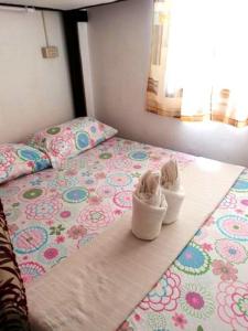 Postel nebo postele na pokoji v ubytování Gaea's Apartments