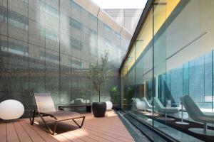a lobby with chairs and a building at Cerulean Tower Tokyu Hotel, A Pan Pacific Partner Hotel in Tokyo