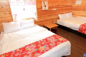 Postel nebo postele na pokoji v ubytování Zuo An Hostel