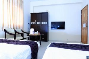 Postel nebo postele na pokoji v ubytování Zuo An Hostel