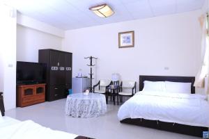 Postel nebo postele na pokoji v ubytování Zuo An Hostel