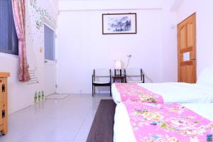 Postel nebo postele na pokoji v ubytování Zuo An Hostel