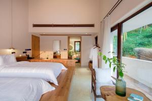 Ένα ή περισσότερα κρεβάτια σε δωμάτιο στο Leaf One Mogan