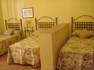 A bed or beds in a room at Cortijo Molino San Juan