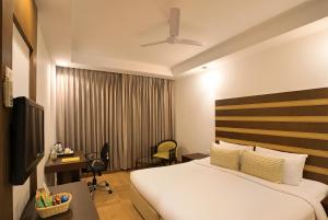 Lemon Tree Hotel Alwar客房内的一张或多张床位