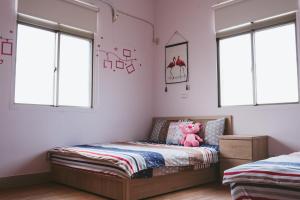 Postel nebo postele na pokoji v ubytování Dan Bao Homestay