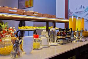 a counter topped with lots of condiments on a table at Hoi An Hai Au Boutique Hotel in Hoi An +85 photos