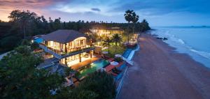 an aerial view of a house on the beach at Saai Resort in Bang Saphan Noi