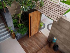 an overhead view of a wooden door in a building at Saai Resort in Bang Saphan Noi