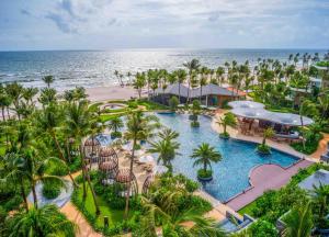 an aerial view of a resort with a pool and the ocean at InterContinental Phu Quoc Long Beach Resort, an IHG Hotel in Phu Quoc