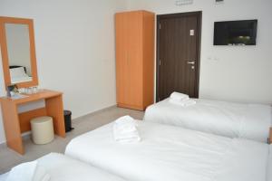 Postel nebo postele na pokoji v ubytování Deltix Apartments