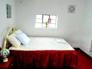 Rúm í herbergi á Cuzco Central Hostel