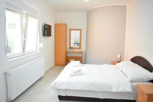 Postel nebo postele na pokoji v ubytování Deltix Apartments