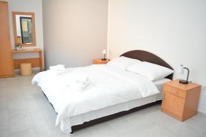 Postel nebo postele na pokoji v ubytování Deltix Apartments