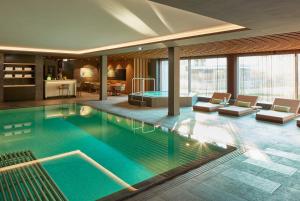 a large swimming pool in a hotel room at Hard Rock Hotel Davos in Davos