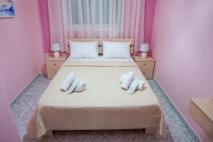 Ένα ή περισσότερα κρεβάτια σε δωμάτιο στο Kalamitsa Beach View