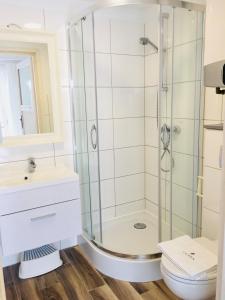 a bathroom with a shower and a toilet at 8 Sosen Pobierowo in Pobierowo +29 photos
