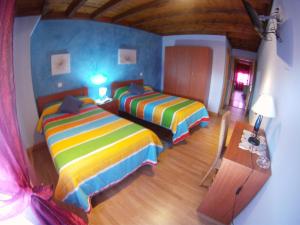Cama o camas de una habitación en Hotel El Golobar