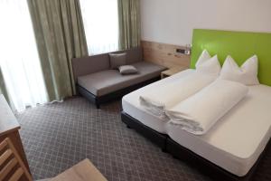 Postel nebo postele na pokoji v ubytování Hotel Mozart