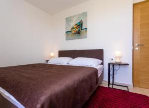 Ein Bett oder Betten in einem Zimmer der Unterkunft Villa Neda