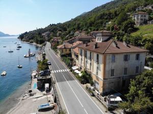 a view of a town next to the water at Affittacamere Trattoria Della Cascata in Oggebbio +84 photos