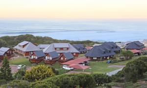 an aerial view of a home with houses at Brenton on Sea Cottages in Brenton-on-Sea